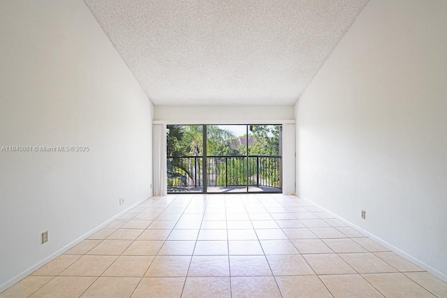 9033 Wiles Rd Unit 304, Coral Springs, FL 33067 - spare room with a textured ceiling and light tile patterned floors