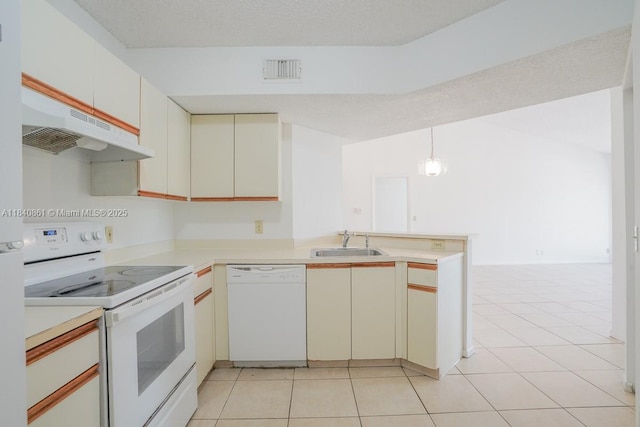 9033 Wiles Rd Unit 304, Coral Springs, FL 33067 - kitchen with white appliances, a peninsula, under cabinet range hood, light countertops, and light tile patterned flooring