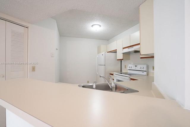 9033 Wiles Rd Unit 304, Coral Springs, FL 33067 - kitchen with white range with electric cooktop, a textured ceiling, a peninsula, light countertops, and white cabinetry