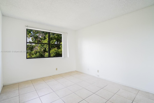 9033 Wiles Rd Unit 304, Coral Springs, FL 33067 - empty room featuring a textured ceiling and light tile patterned floors