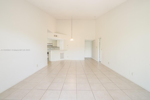 9033 Wiles Rd Unit 304, Coral Springs, FL 33067 - unfurnished living room featuring high vaulted ceiling