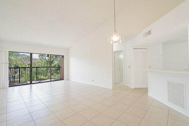 9033 Wiles Rd Unit 304, Coral Springs, FL 33067 - empty room with a chandelier, lofted ceiling, and light tile patterned flooring