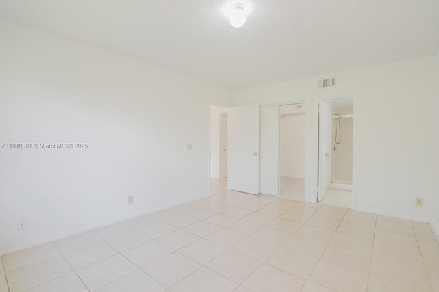 9033 Wiles Rd Unit 304, Coral Springs, FL 33067 - unfurnished room with light tile patterned flooring