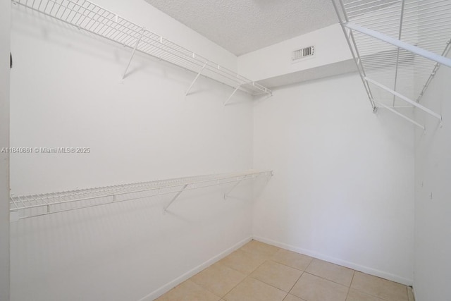 9033 Wiles Rd Unit 304, Coral Springs, FL 33067 - spacious closet with light tile patterned floors