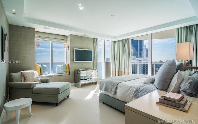 bedroom featuring a wall of windows