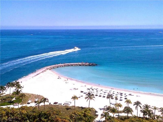 aerial view featuring a water view and a beach view