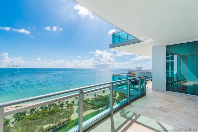 balcony featuring a water view