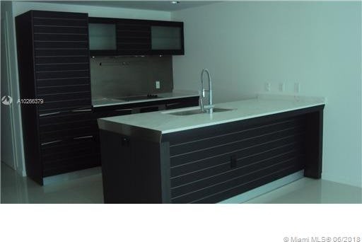 kitchen featuring sink and black electric cooktop