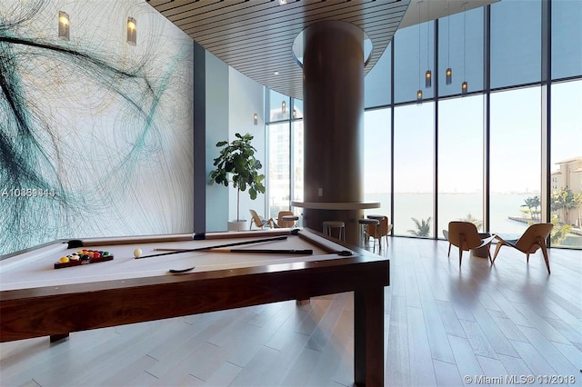 recreation room with expansive windows, light wood-type flooring, and billiards