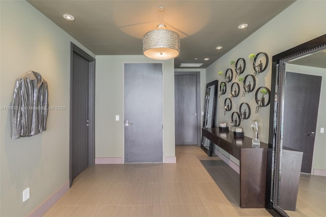 corridor featuring light tile patterned floors