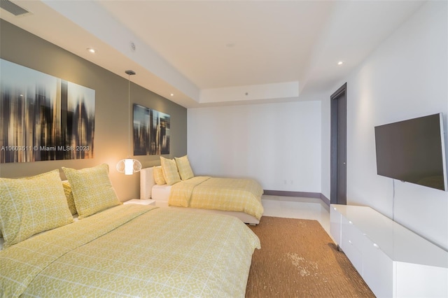 bedroom featuring a tray ceiling