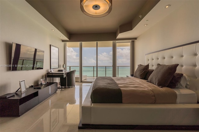 bedroom featuring access to outside, tile patterned flooring, and a water view