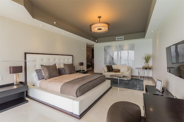 tiled bedroom with a raised ceiling