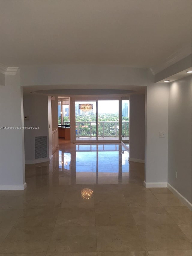 tiled empty room with crown molding