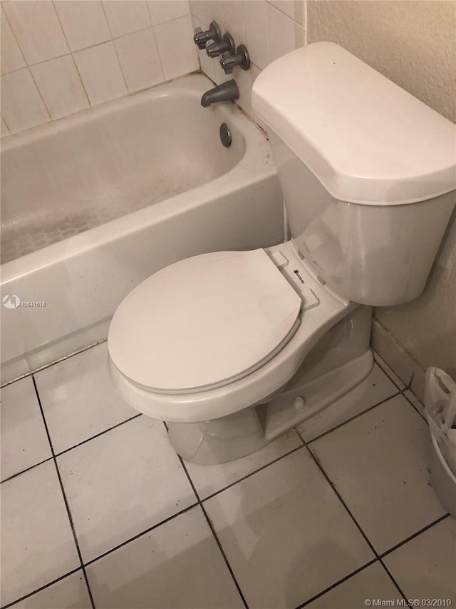 bathroom featuring toilet and tile patterned floors