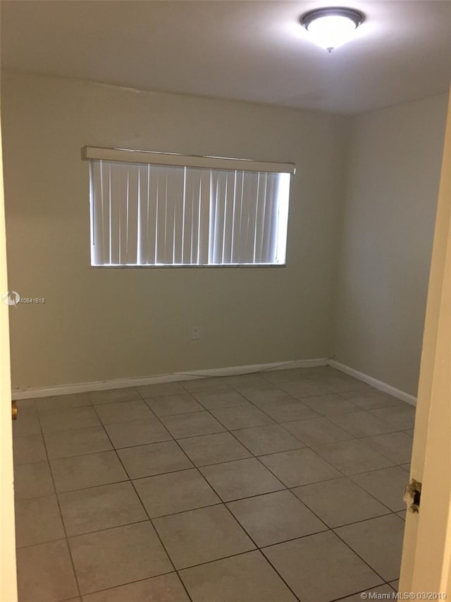 spare room featuring tile patterned floors