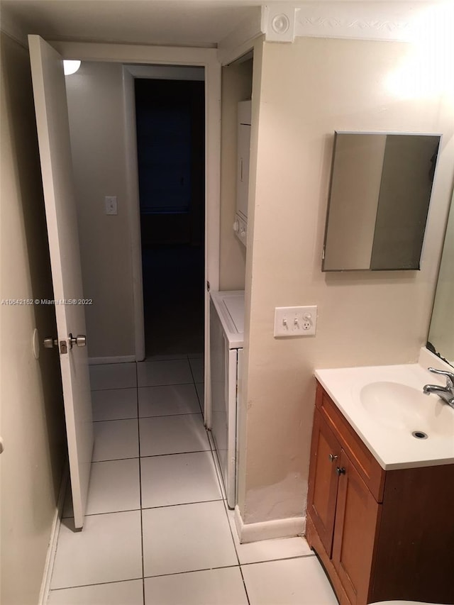 bathroom with vanity with extensive cabinet space and tile flooring