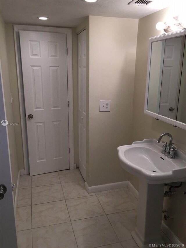 bathroom featuring tile flooring