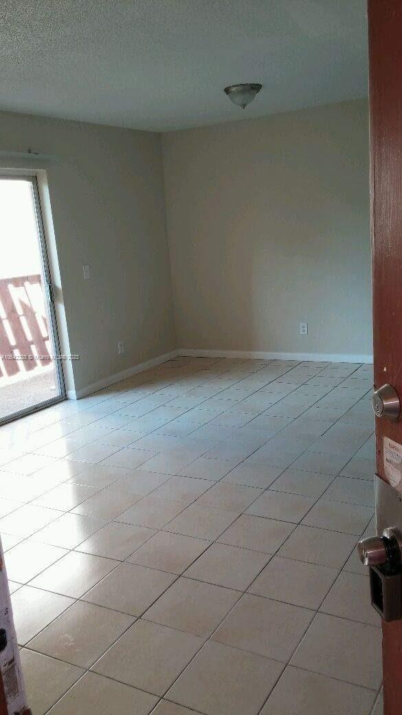 unfurnished room with a textured ceiling