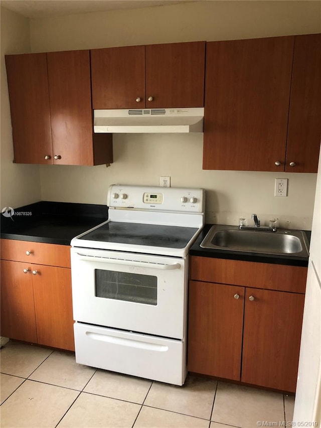 kitchen with electric stove, sink, and light tile patterned floors