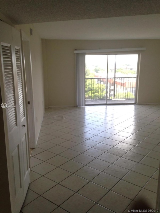 view of tiled spare room