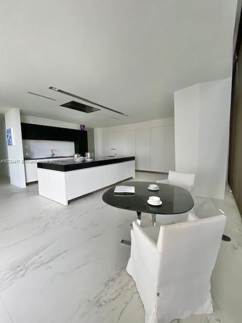 kitchen featuring white cabinets