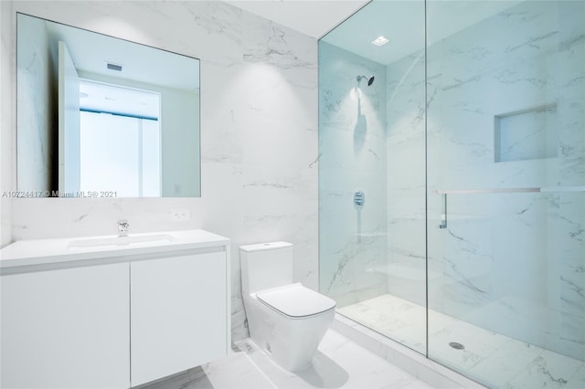 bathroom featuring tile flooring, a shower with shower door, toilet, and tile walls