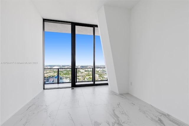 tiled empty room with expansive windows