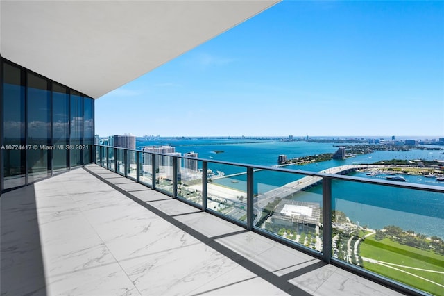 balcony featuring a water view