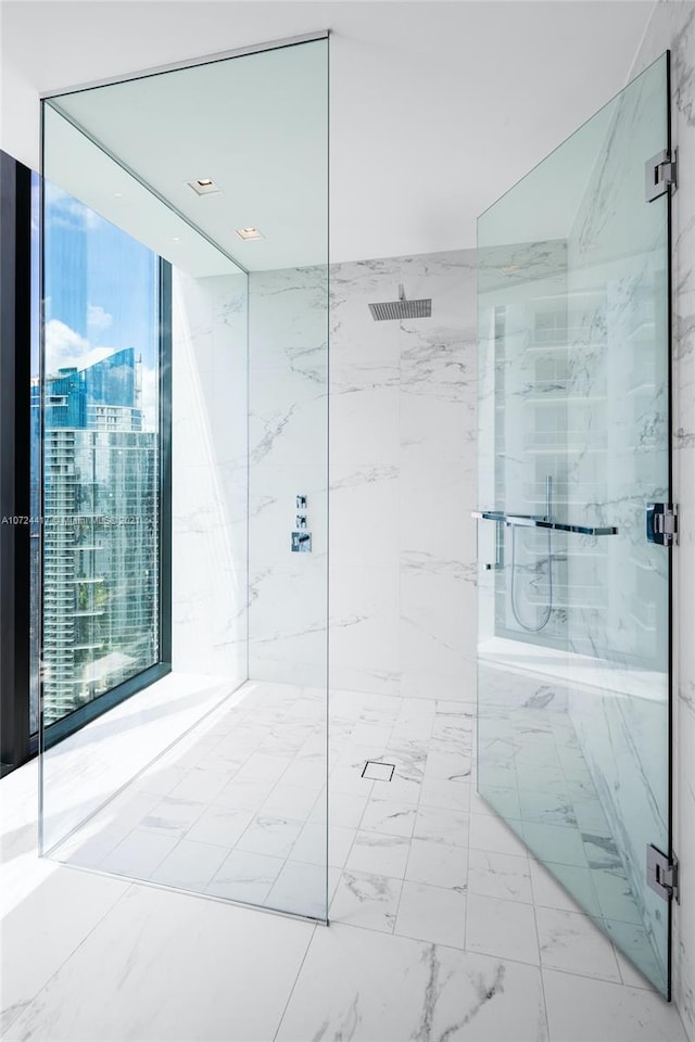 bathroom with an enclosed shower and tile floors