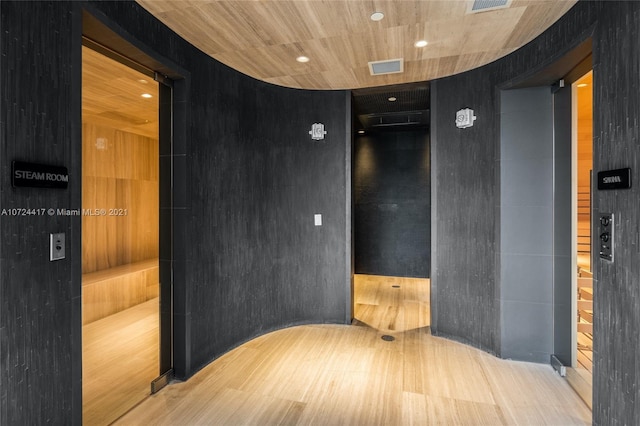 corridor featuring light hardwood / wood-style floors