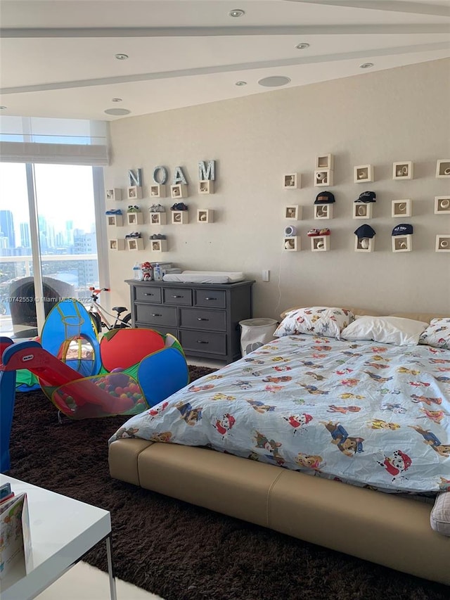 bedroom with lofted ceiling