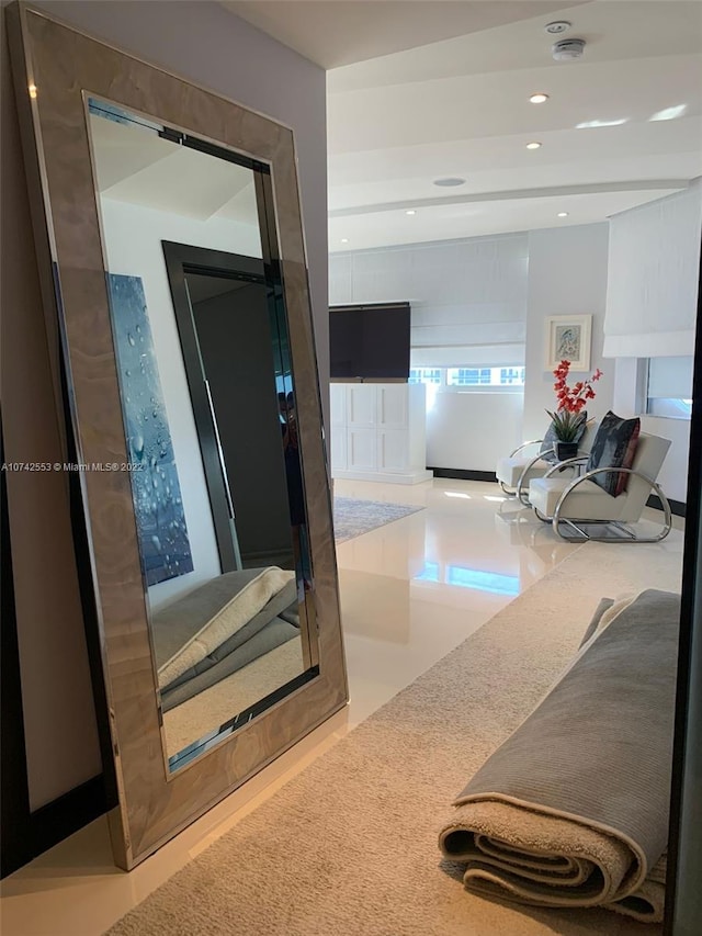 hall featuring light tile floors