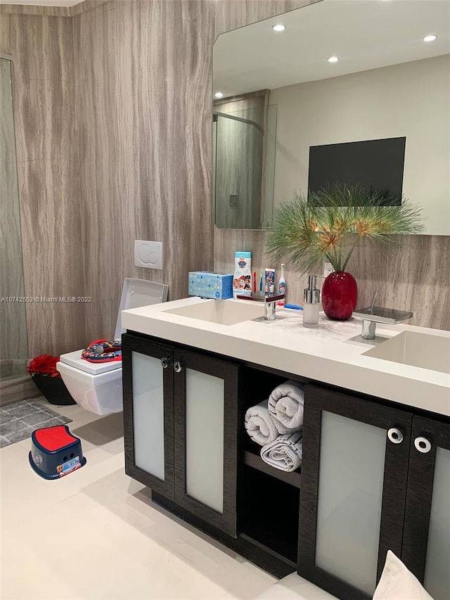 bathroom featuring tile floors and dual bowl vanity