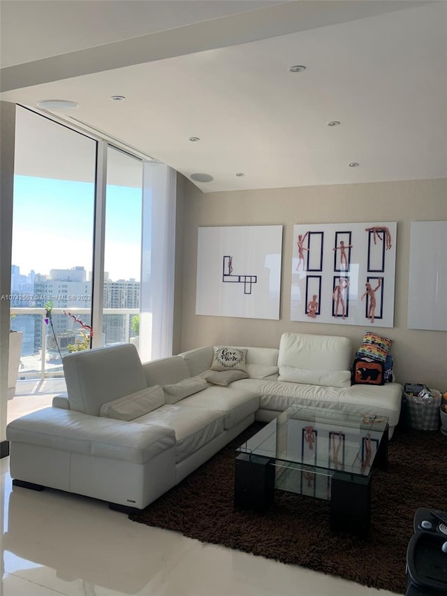 tiled living room with floor to ceiling windows