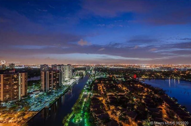 aerial view at dusk with a water view