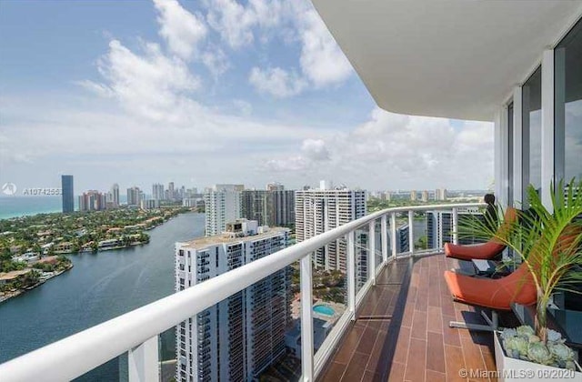 balcony featuring a water view