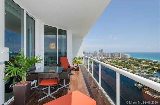 balcony featuring a water view