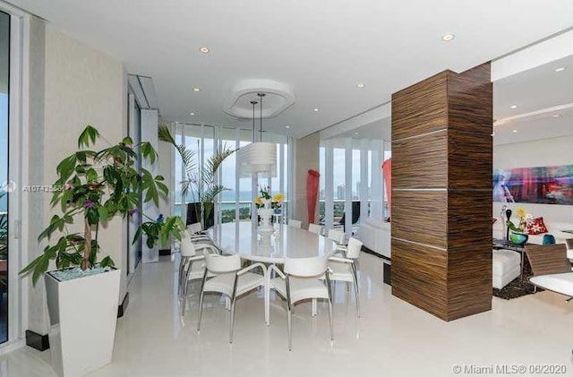 dining room with floor to ceiling windows