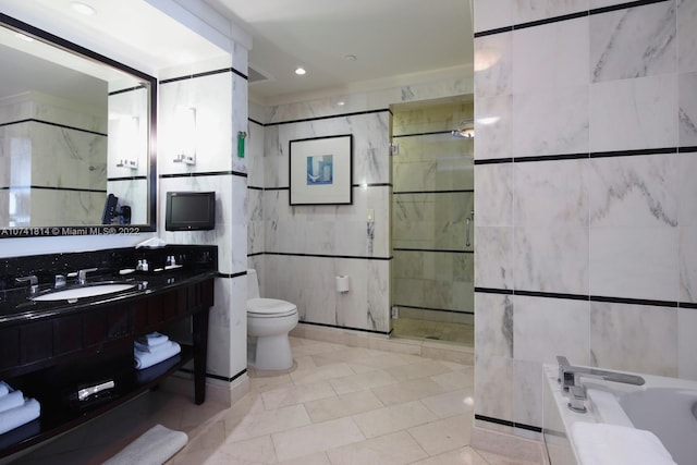 full bathroom featuring tile walls, toilet, tile floors, and vanity