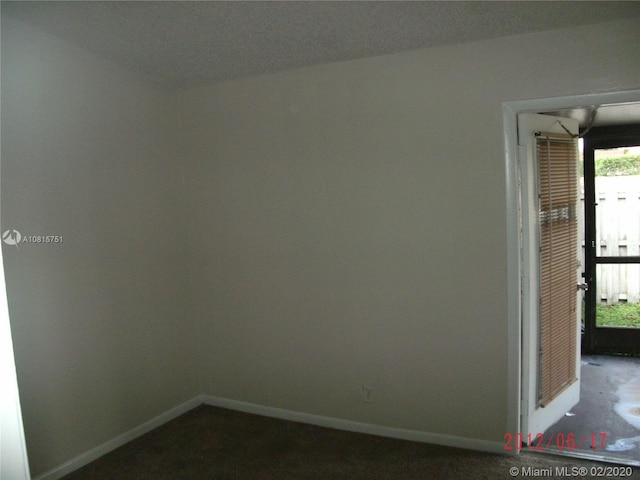 empty room featuring a textured ceiling