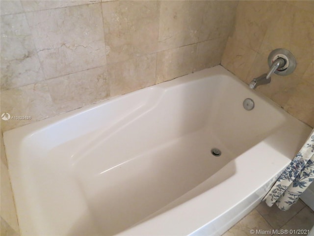 full bath featuring tile patterned flooring