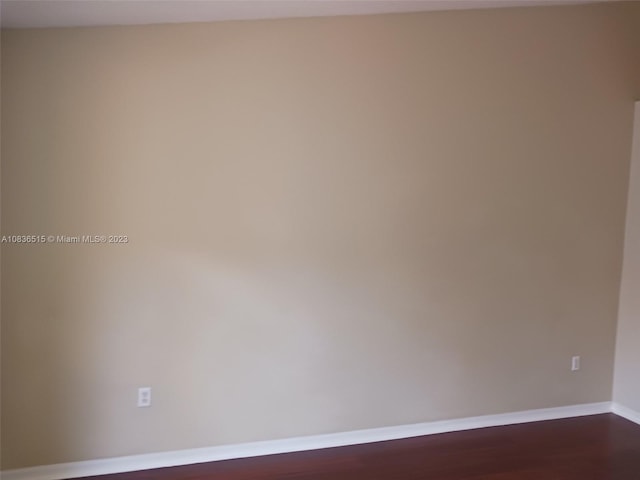 spare room featuring hardwood / wood-style flooring