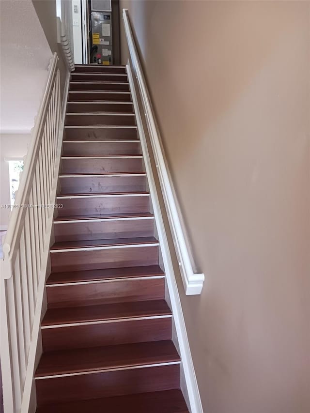 stairs with wood-type flooring