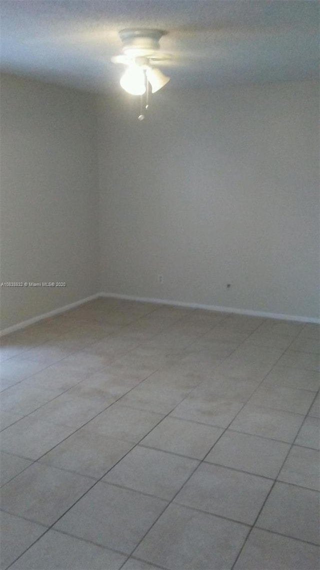 spare room with light tile patterned floors