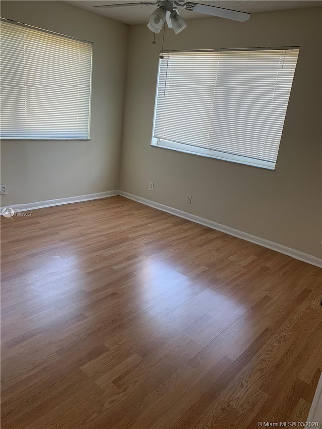 unfurnished room featuring ceiling fan and light hardwood / wood-style floors