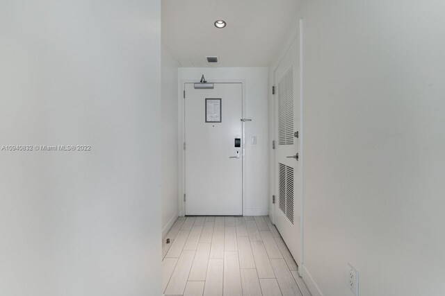 hallway with light wood-type flooring