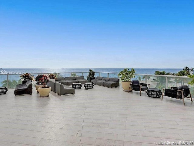 view of patio / terrace with an outdoor hangout area and a water view