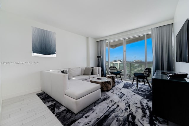 living area featuring wood finished floors and baseboards