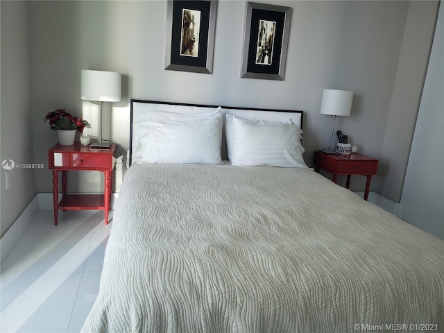 bedroom featuring light tile floors